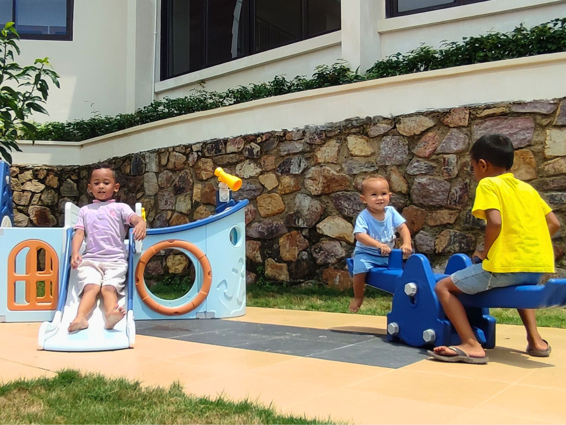 Children playing at the playground at The Happinezz Hills